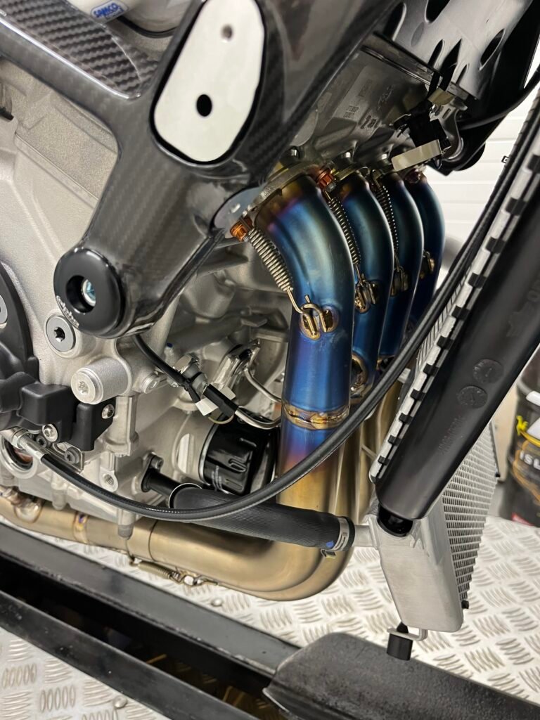 Race bike under construction — exhaust system